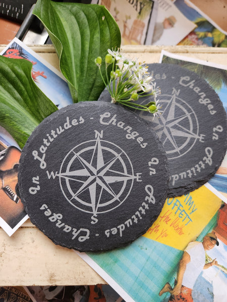 Set of 2 "Changes in Latitudes Changes in Attitudes" slate coasters, one of Jimmy Buffetts greatest songs
